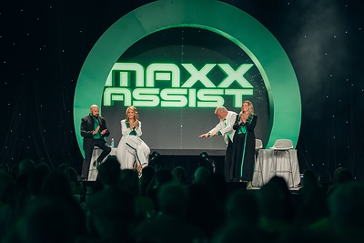 From left, Brian Shultz, CIO; Michelle Fee, founder and CEO; Scott Koepf, chief strategy officer; and Theresa Scalzitti, COO of Cruise Planners, introduce Maxx Assist at CP World 2026 in Fort Lauderdale, Florida.