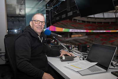 Don Andrews cheering on climbers from the sound booth (c) WWF-Canada/Beau Chevalier
