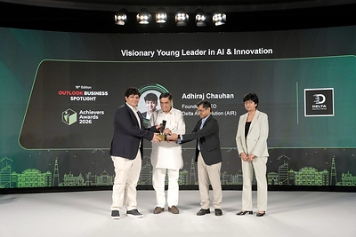 Adhiraj Chauhan (L) accepting the Visionary Young Leader Award in AI & Innovation from Mohan Singh Bisht, Delhi Legislative Assembly (Center) & Sudipto Dey (R), Editor, Outlook Planet, at the Outlook Business Awards