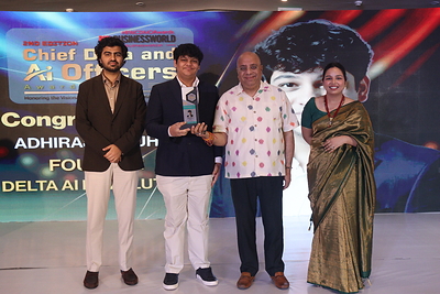 Adhiraj Chauhan (center) receiving the Young AI Entrepreneur of the Year award from Dr. Annurag Batra, Chairman and Editor-in-chief, BW Businessworld (right)