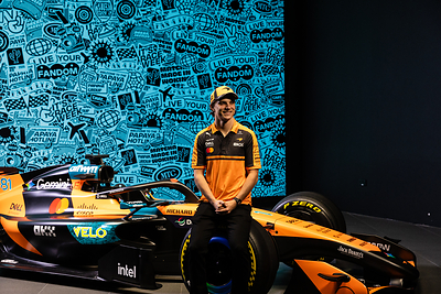 McLaren Mastercard Formula 1® Team driver Oscar Piastri leans against the McLaren car featuring Velo and McLaren’s new ‘Livery of Dreams’, unveiled for the Mexico City Grand Prix as a celebration of fan creativity, individuality and self-expression.