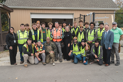 Steel Apple honoree Aaron Swett with Todd Corley, Chief People & Impact Officer at Carhartt, Stephanie Watts, Director of Philanthropy at NCCER, and his Oakland Schools Technical Northeast students and administration.