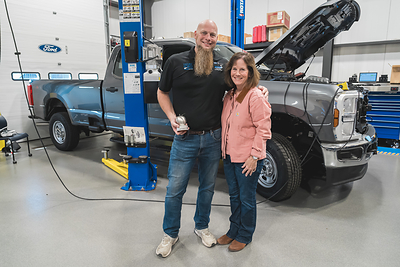 Henry Ford College's Kris Young recognized for the Steel Apple Award by Carhartt CEO Linda Hubbard.