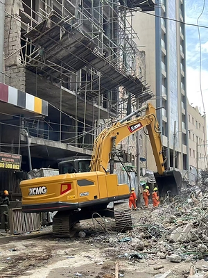 An XCMG excavator is deployed at the site of a collapsed building in Nairobi to assist rescue teams in clearing debris and locating survivors.