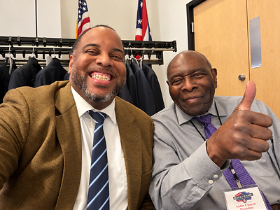 An AFA Hall of Fame weekend guest and AFA President Dave Burch share a moment during the celebration.