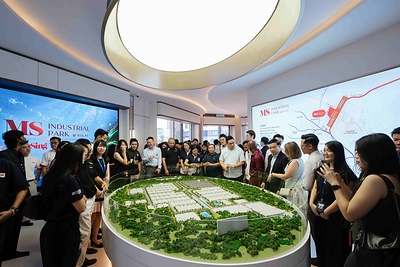 Guests viewing the scale model during the Sales Gallery Opening