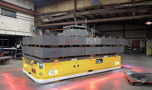Align 130,000 lb die transporter during load testing, ready to move heavy dies safely across the plant floor. Align 130,000 lb die transporter during load testing, ready to move heavy dies safely across the plant floor.