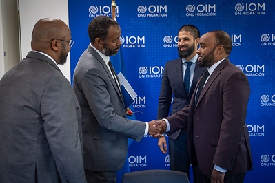 IOM Chief of Staff Mohammed Abdiker greets members of the HDF delegation at IOM headquarters in Geneva.