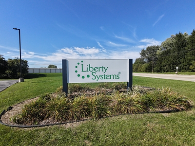 Signage marks the entrance to Liberty Systems’ new North American headquarters in Oconomowoc, Wis., following the company’s move from Waukesha.
