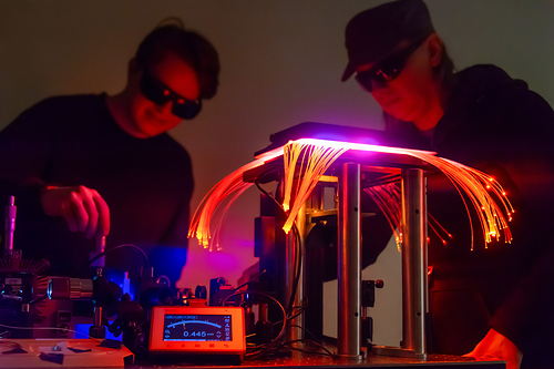 Photo of UbiQD researchers working on a single photon emitting quantum dot device supported by the EDNM grant. Courtesy of UbiQD, Inc. Photo of UbiQD researchers working on a single photon emitting quantum dot device supported by the EDNM grant. Courtesy of UbiQD, Inc.