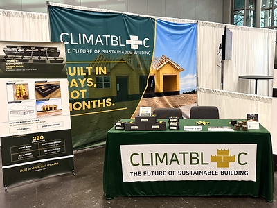 ClimatBloc's booth at the Greenbuild International Conference + Expo, where the team used 3D-printed scale models to show how its interlocking wall system goes together.