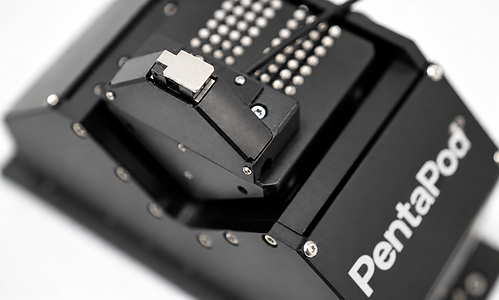 Close up of the PentaPod precision mount, with its machined black housing, pin grid, and stainless steel clamp. Close up of the PentaPod precision mount, with its machined black housing, pin grid, and stainless steel clamp.