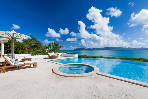 Relax poolside at oceanfront Villa Alegria Anguilla. This luxury private retreat overlooks the Caribbean Sea and mountains of neighboring island, St. Martin. Photo: Villa Alegria Anguilla Relax poolside at oceanfront Villa Alegria Anguilla. This luxury private retreat overlooks the Caribbean Sea and mountains of neighboring island, St. Martin. Photo: Villa Alegria Anguilla
