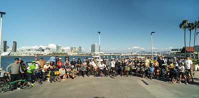 Cyclists gather along the San Diego waterfront following a group journey aboard the Amtrak Pacific Surfliner as part of a partnership with Brompton.