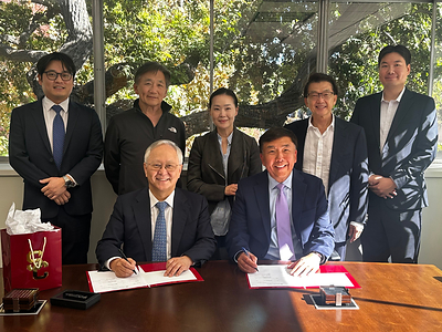 Representatives of the two institutions pose for a commemorative photograph following a signing ceremony held at USC Herman Ostrow School of Dentistry.