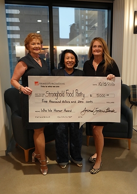 Armed Forces Bank presents a $5,000 donation to Stronghold Food Pantry in recognition of founder Monica Bassett’s dedication to supporting military families. Pictured (from left) are Tina Farr, Armed Forces Bank Fort Leavenworth Installation Manager; Bassett; and Heather Schnider, Armed Forces Bank Mortgage Loan Officer.