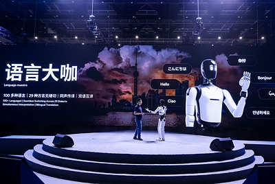 Xiong Yan, Partner, Executive Director, Co-President, President of Central R&D, and President of the Interaction Business at AGIBOT, presents WITA-Omni and its planned deployment roadmap for more natural, multimodal human–robot interaction. This image opens in the lightbox